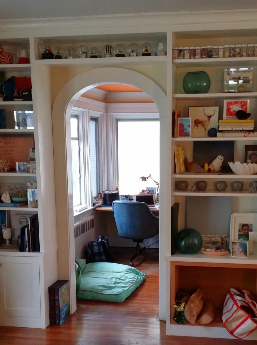An office entry with custom bookcase surround
