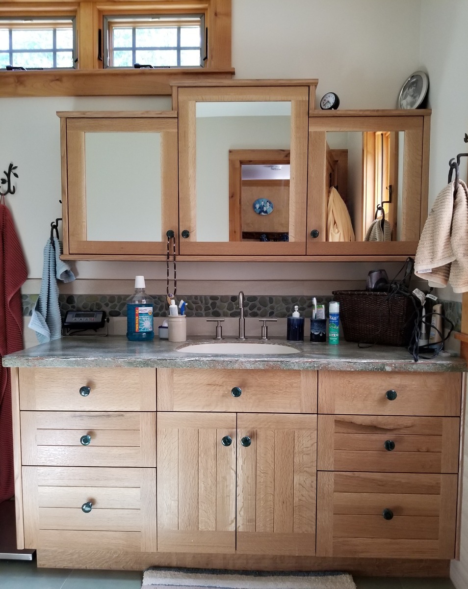 A custom vanity and medicine cabinet in white oak