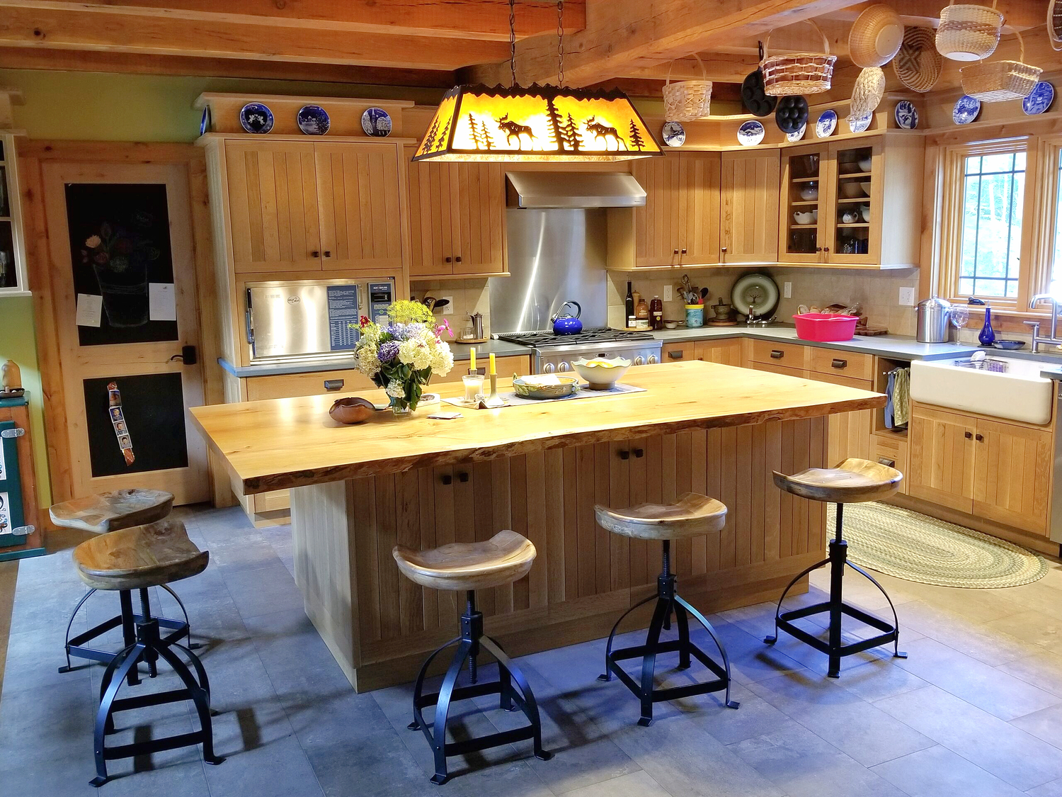 A custom kitchen with island seating in white oak A custom kitchen with island seating in white oak